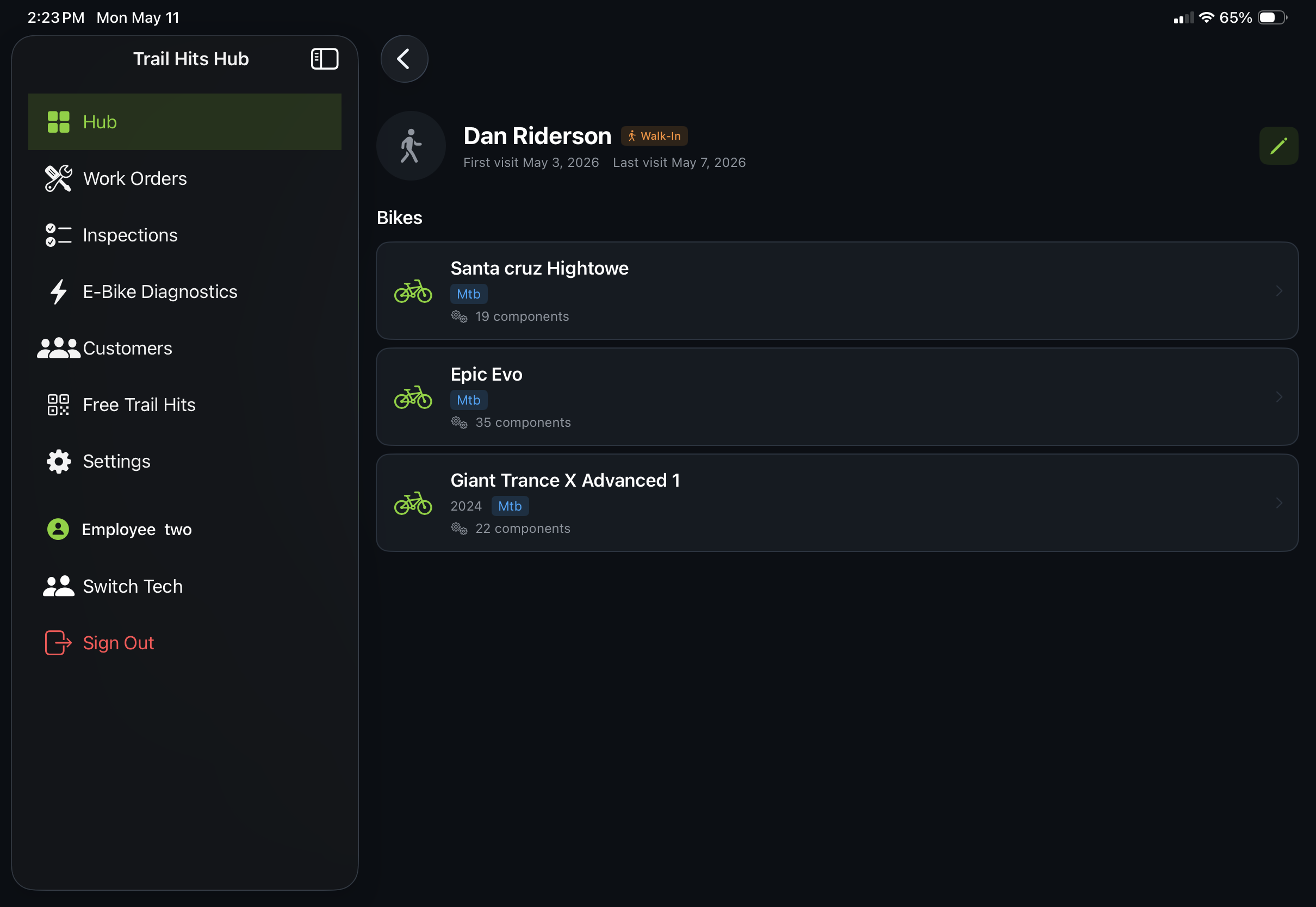 Trail Hits Hub bike shop customer management software on iPad: customer profile with multiple bikes, first and last visit dates, component history